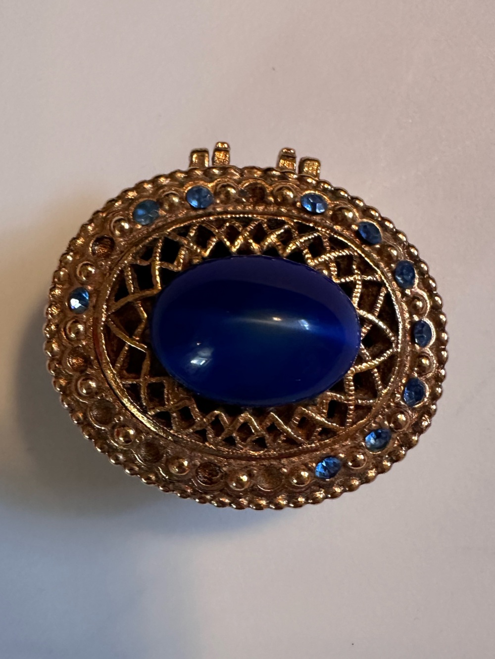Gold-Tone Statement Ring with Deep Blue Teardrop Stone
